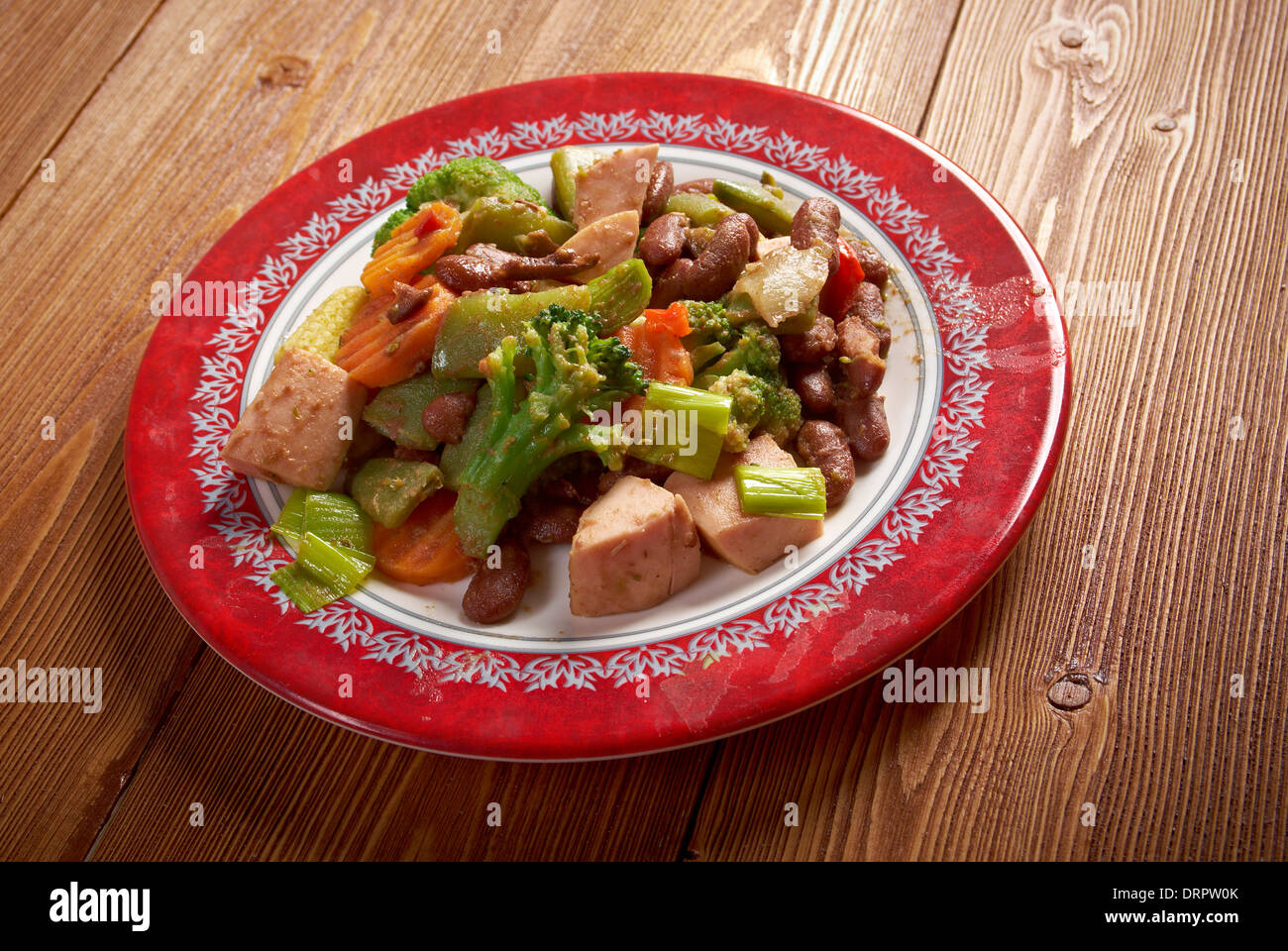 Cassoulet with pork sausage, and beans in the pot Stock Photo
