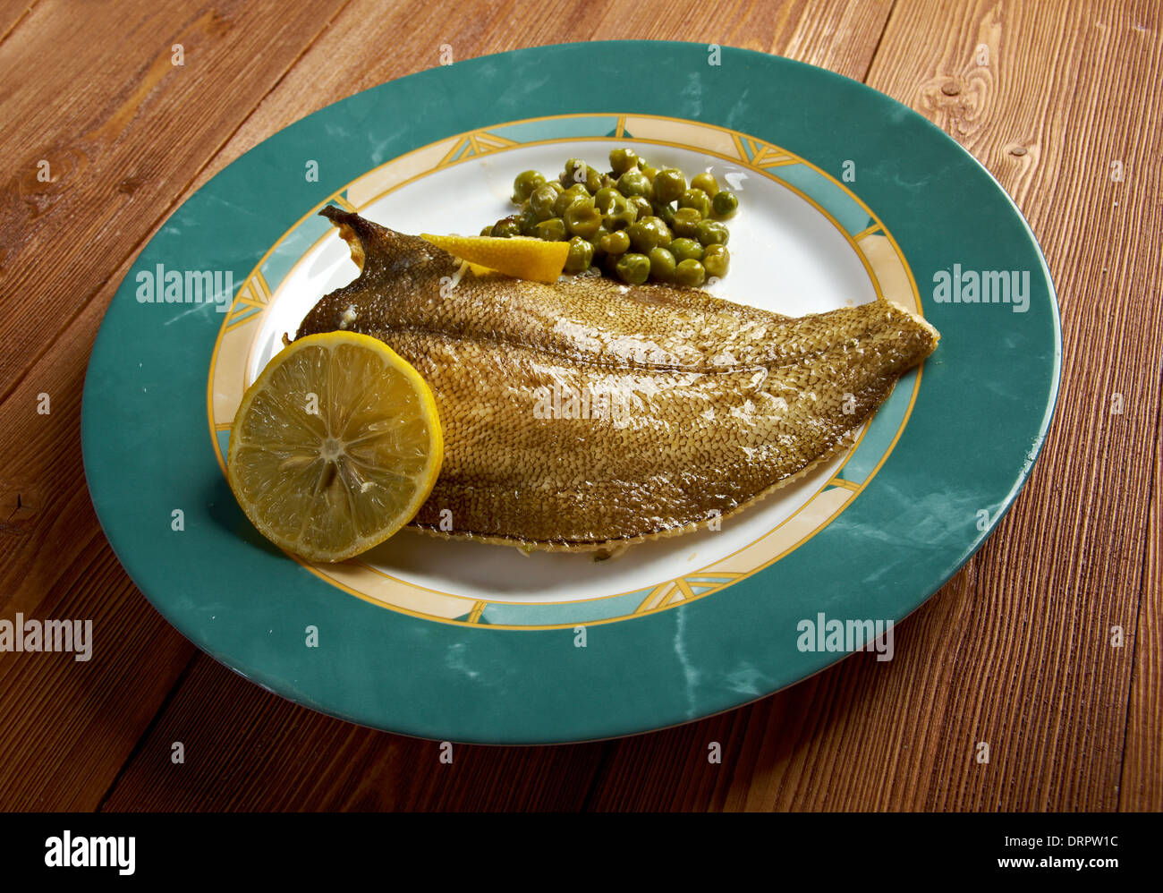 Baked Flounder with vegetables and lemon Stock Photo Alamy
