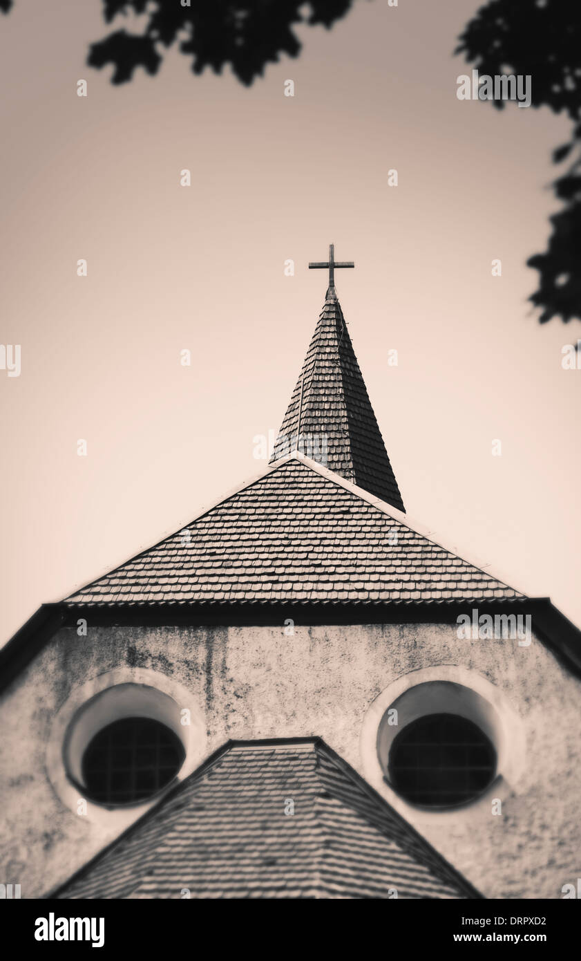 Exterior of old church almost looking like a face with two round windows for eyes, Sweden Stock Photo