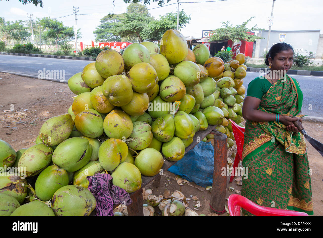 A roadside shop selling unripe coconuts, for coconut water near