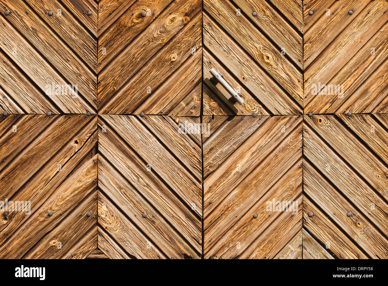 Entrance of old building with large wooden door, Sweden Stock Photo