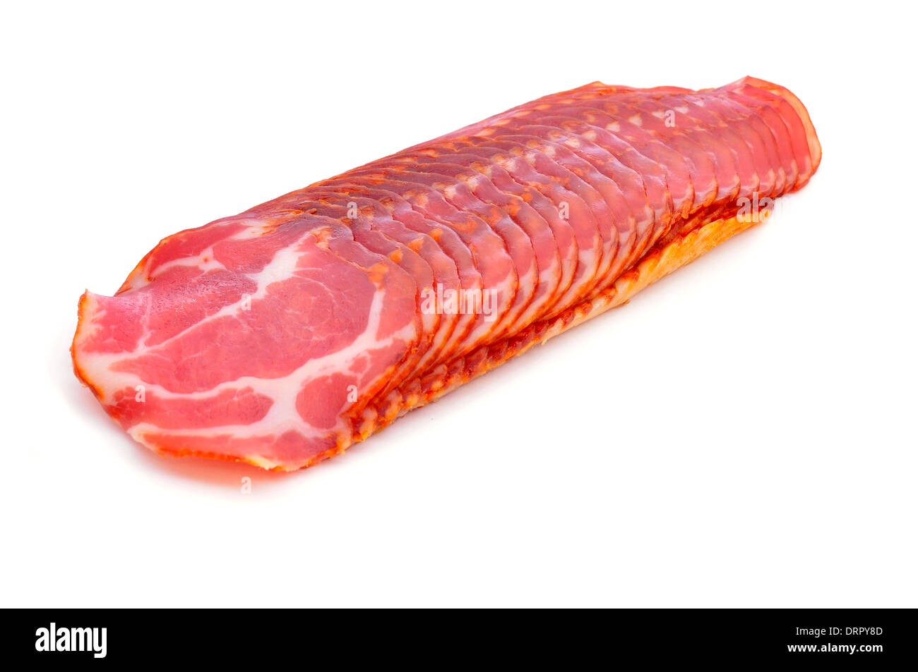 some slices of lomo embuchado, pork meat cold cuts typical of Spain, on a white background Stock Photo