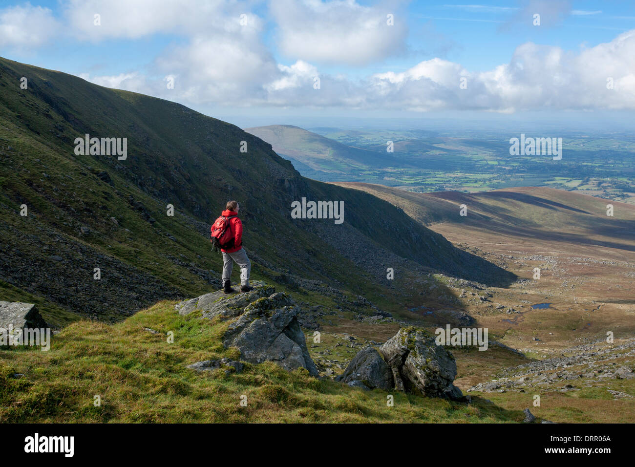 Walker above the North Prison of Lugnaquilla, Wicklow Mountains, County Wicklow, Ireland. Stock Photo
