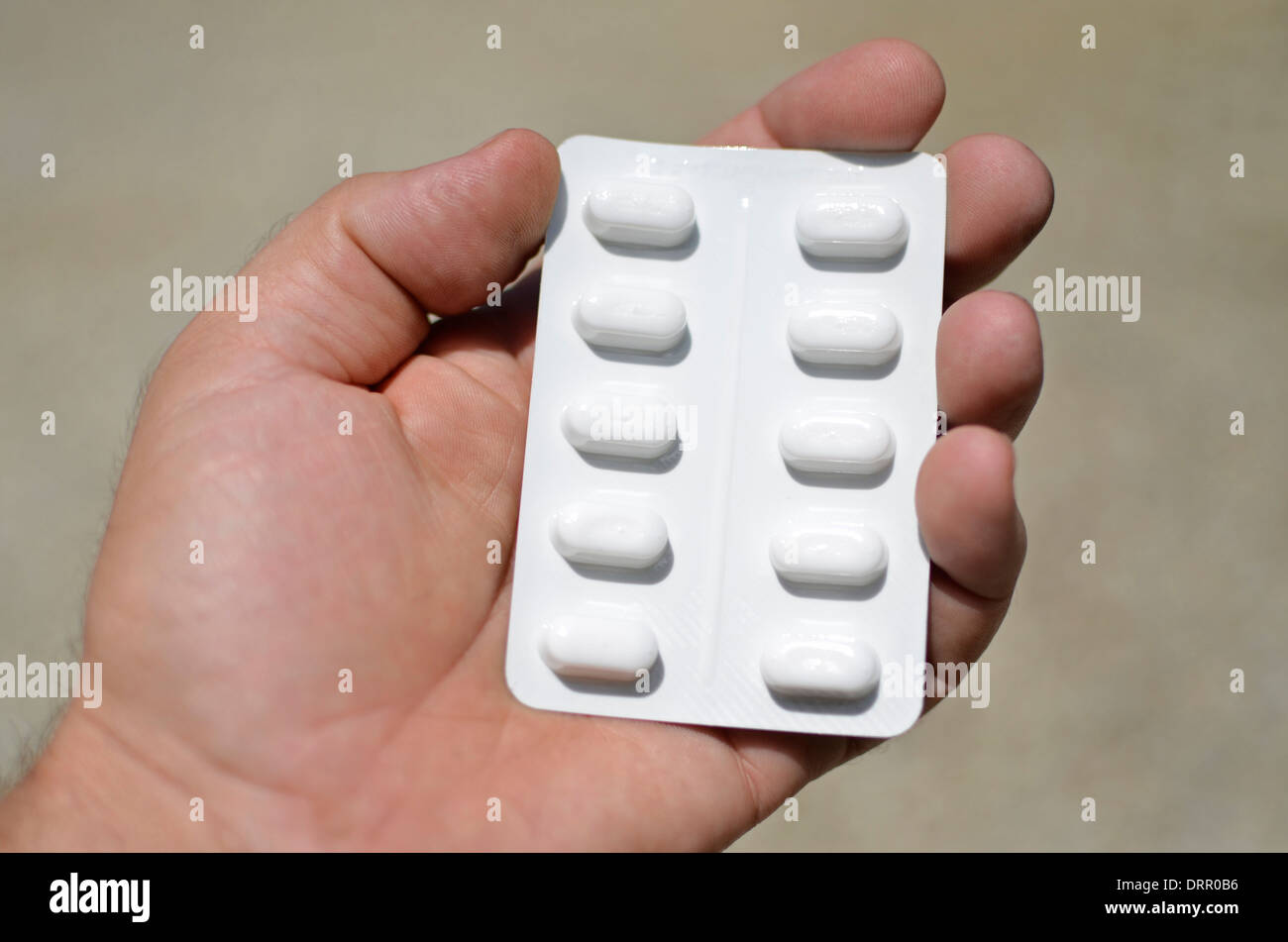 sheet of pills in hand, pharmaceutical, addiction Stock Photo Alamy