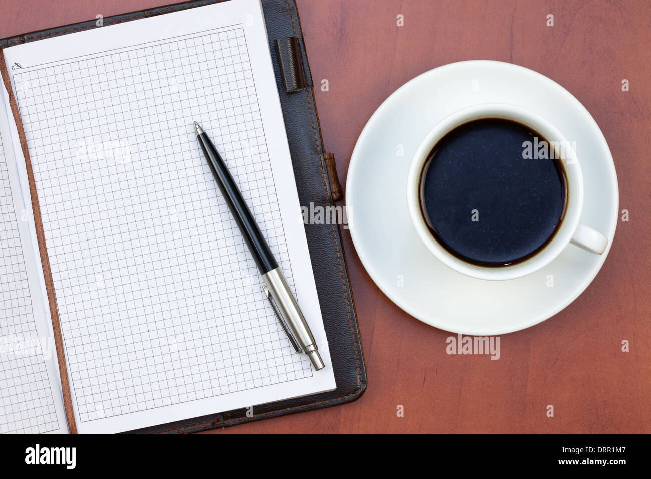 Coffee cup, notebook and pen Stock Photo