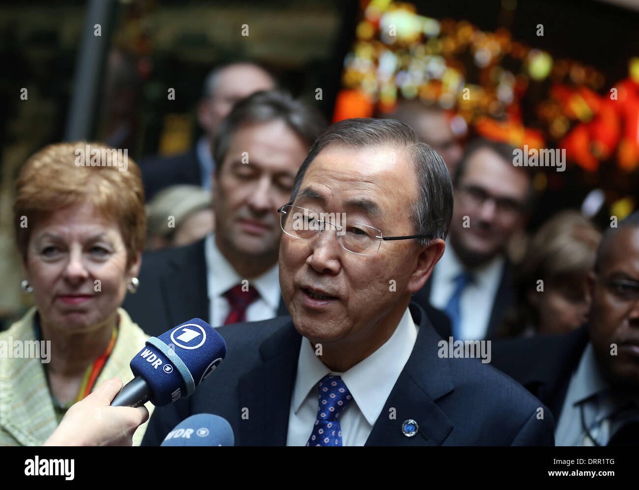 Bonn, Germany. 31st Jan, 2014. UN Secretary General Ban Ki Moon (C), his wife Ban Soon-taek (R) next to NRW Minister for Federal Affairs Ursula Schwall-Dueren (L) speaks to the press in the Haus der Geschichte in Bonn, Germany, 31 January 2014. Ban Ki Moon learned about the work of the UN organizations at their Bonn offices. Photo: OLIVER BERG/dpa/Alamy Live News Stock Photo