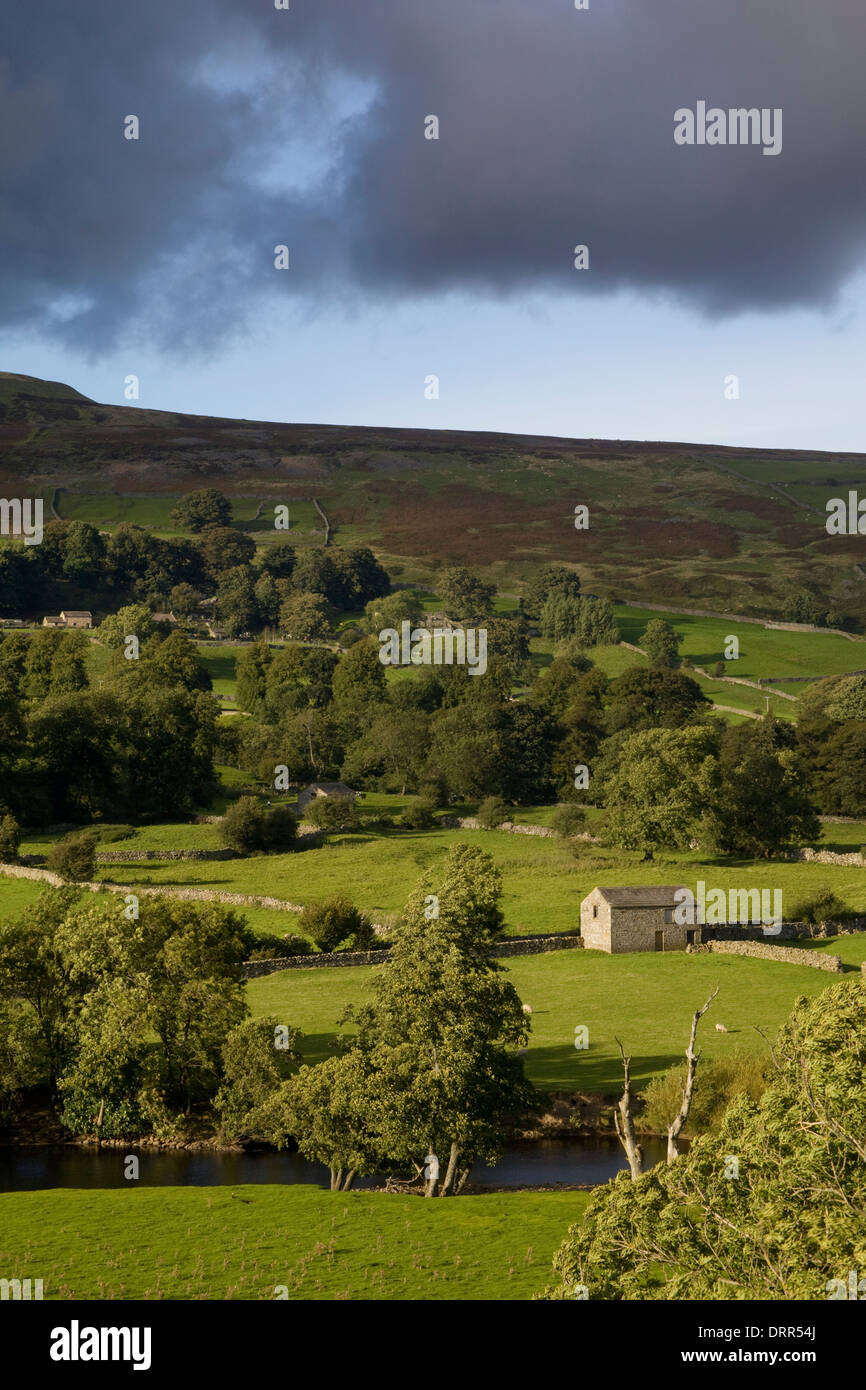 Yorkshire Dales Barn on River Swale Swaledale with storm clouds Stock Photo