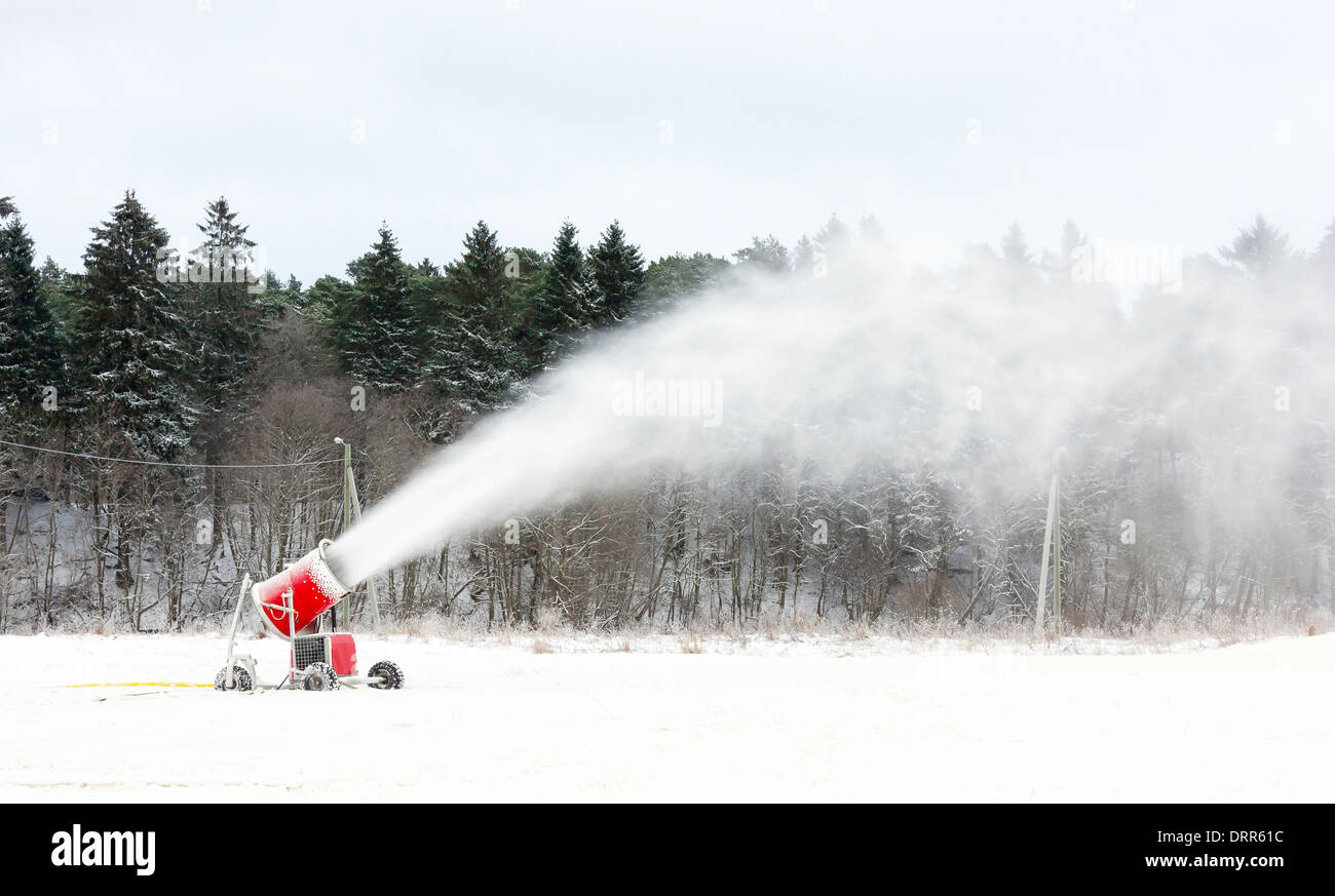 Snow blowing machines or snow cannons making snow Stock Photo Alamy