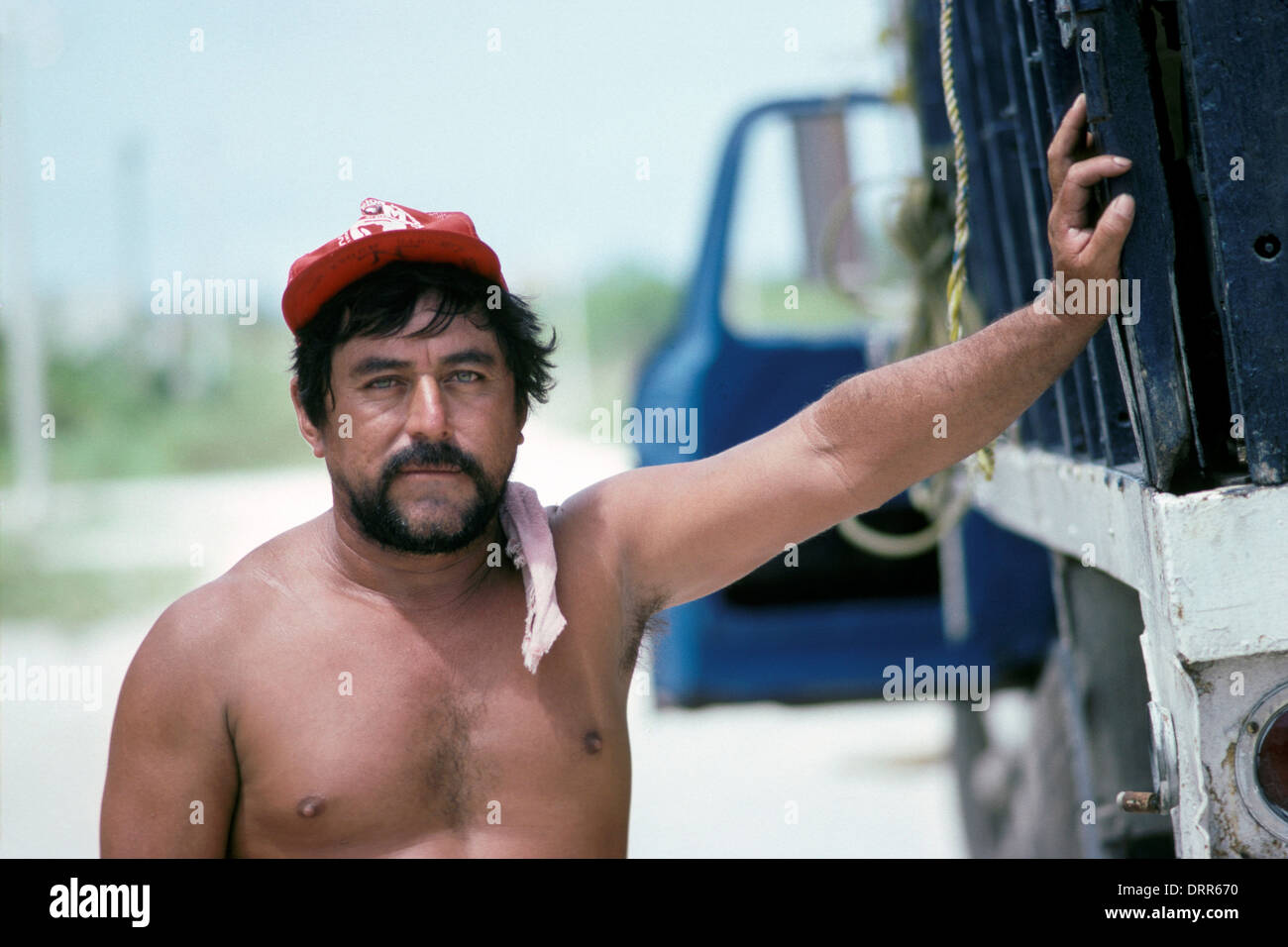 Man standing next to delivery truck in Cozumel, Mexico Stock Photo - Alamy