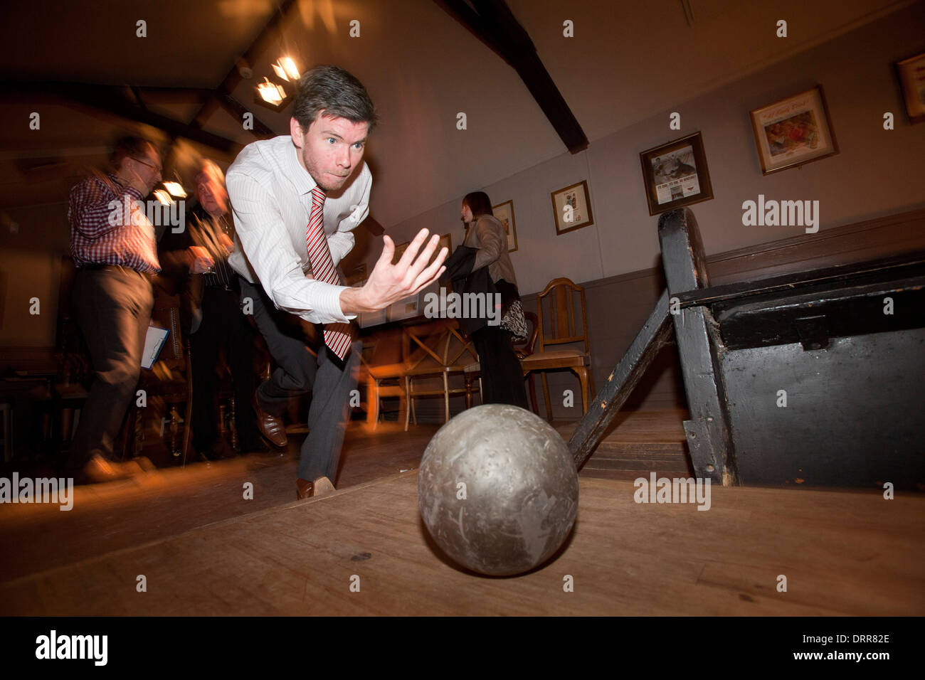 A customer using the bowling alley in the The Sheep Heid Inn, in Duddingston Village, Edinburgh Stock Photo