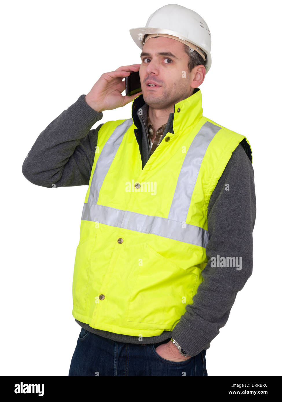 Portrait of engineer with hard hat and yellow reflective safety vest talking on cell phone Stock Photo