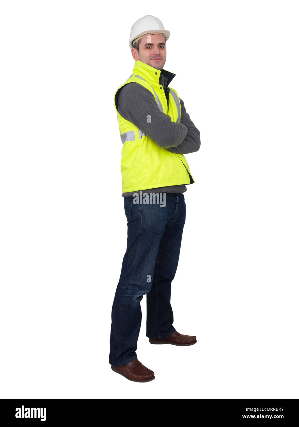 Full-length portrait of engineer with hard hat and yellow reflective safety vest Stock Photo