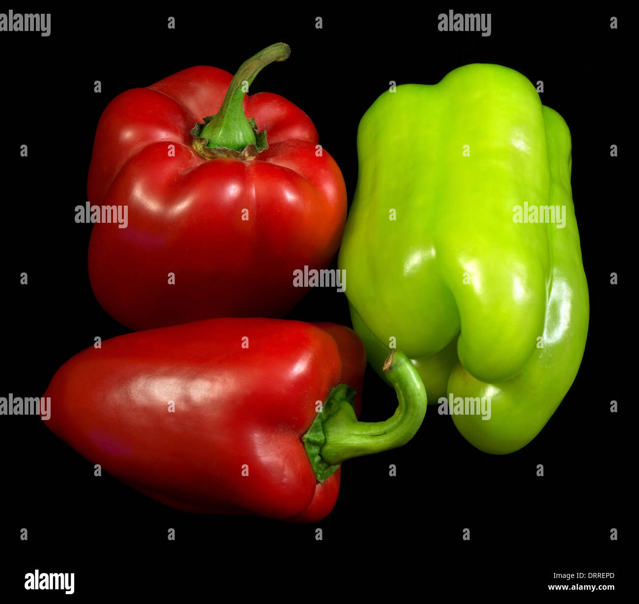 Red and green peppers isolated over black background Stock Photo - Alamy
