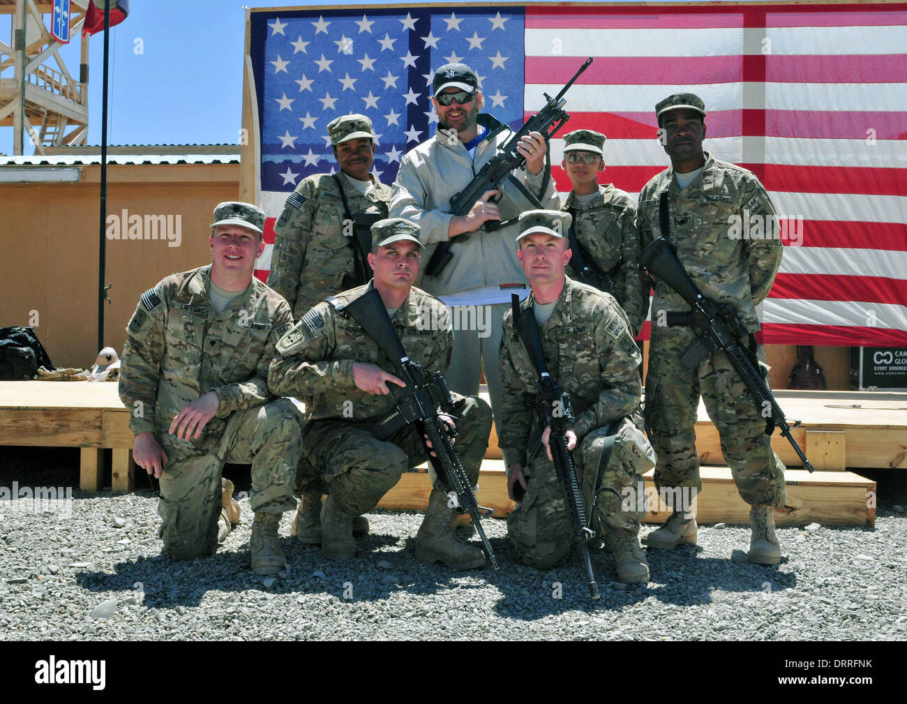 Country music singer songwriter Toby Keith poses with soldiers following a surprise concert April 29, 2012 at Forward Operating Base Sharana in Paktika province, Afghanistan. Stock Photo