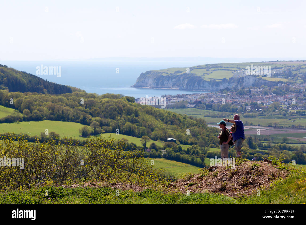 Two people enjoying the view from Musbury Castle, Devon Stock Photo Alamy