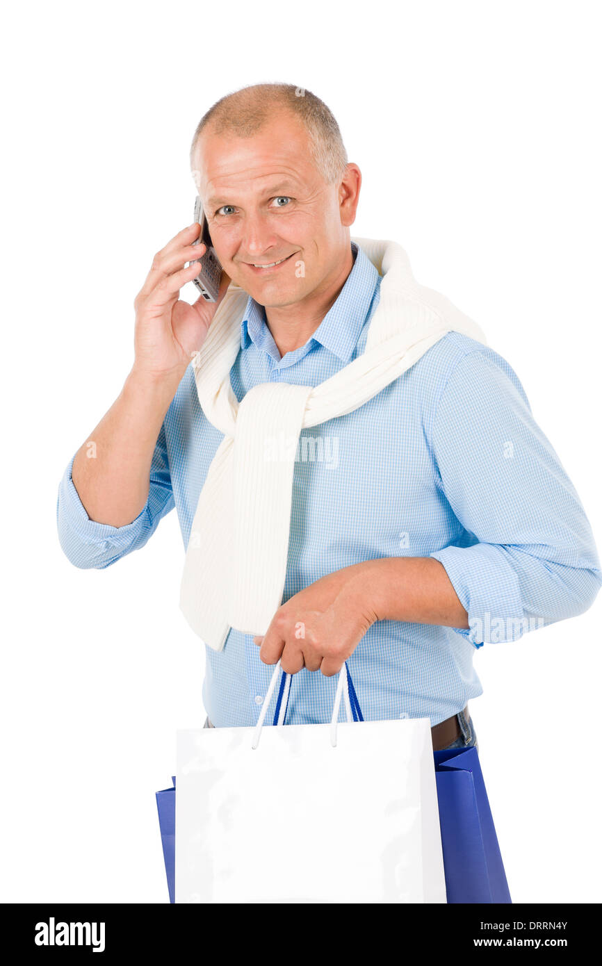 Senior happy man holding shopping bags Stock Photo - Alamy