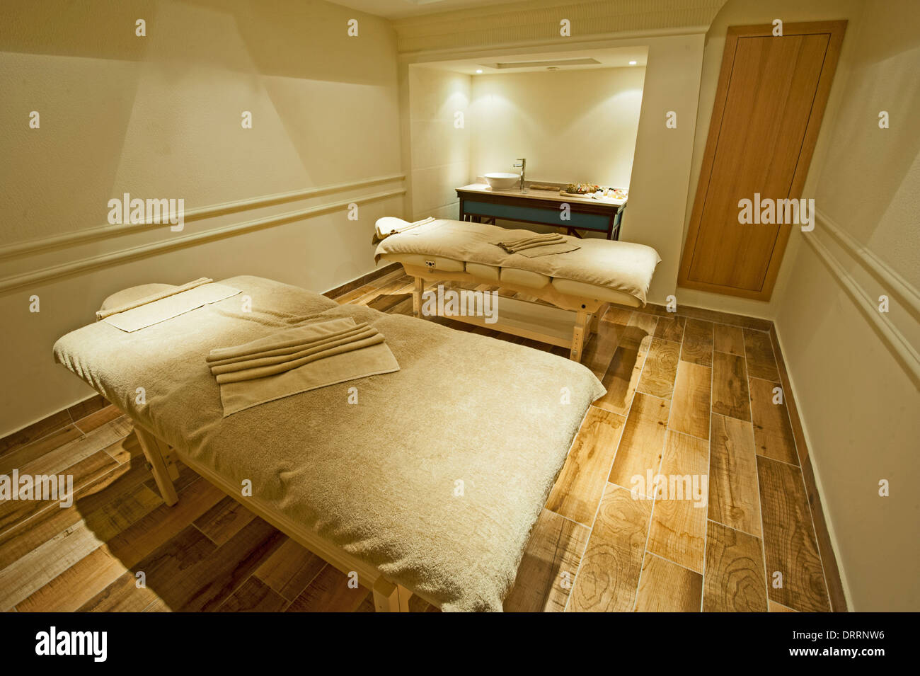 Two massage beds in a room at luxury health spa Stock Photo Alamy