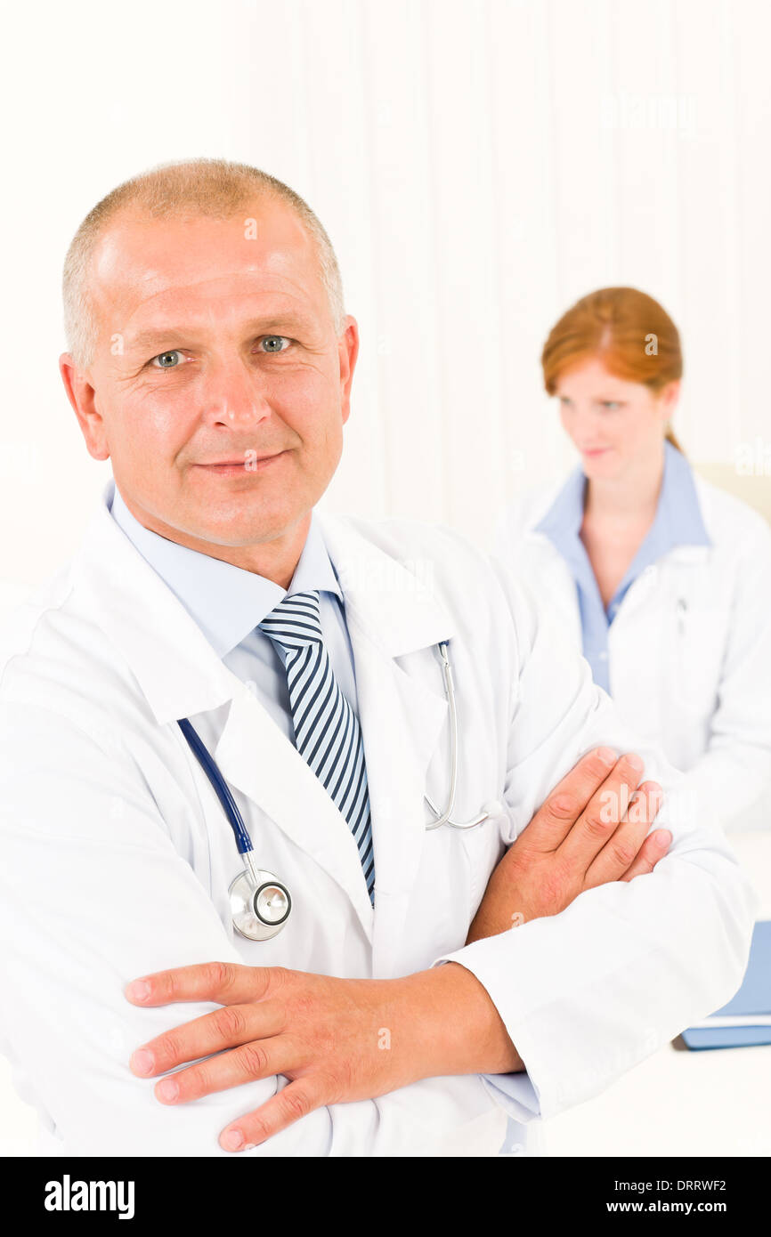 Medical team senior male young woman doctor Stock Photo