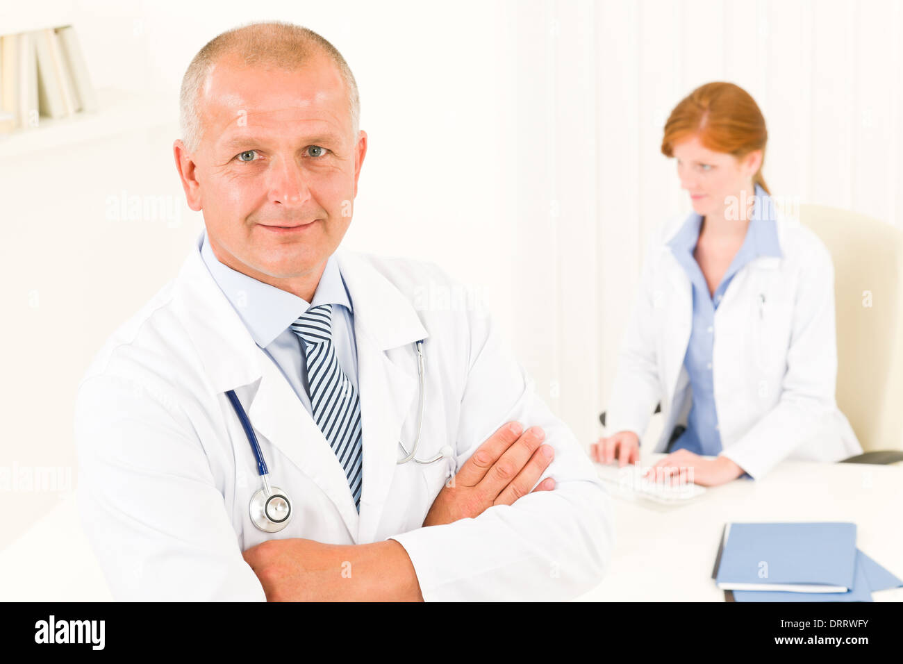 Medical doctor team senior male young woman Stock Photo