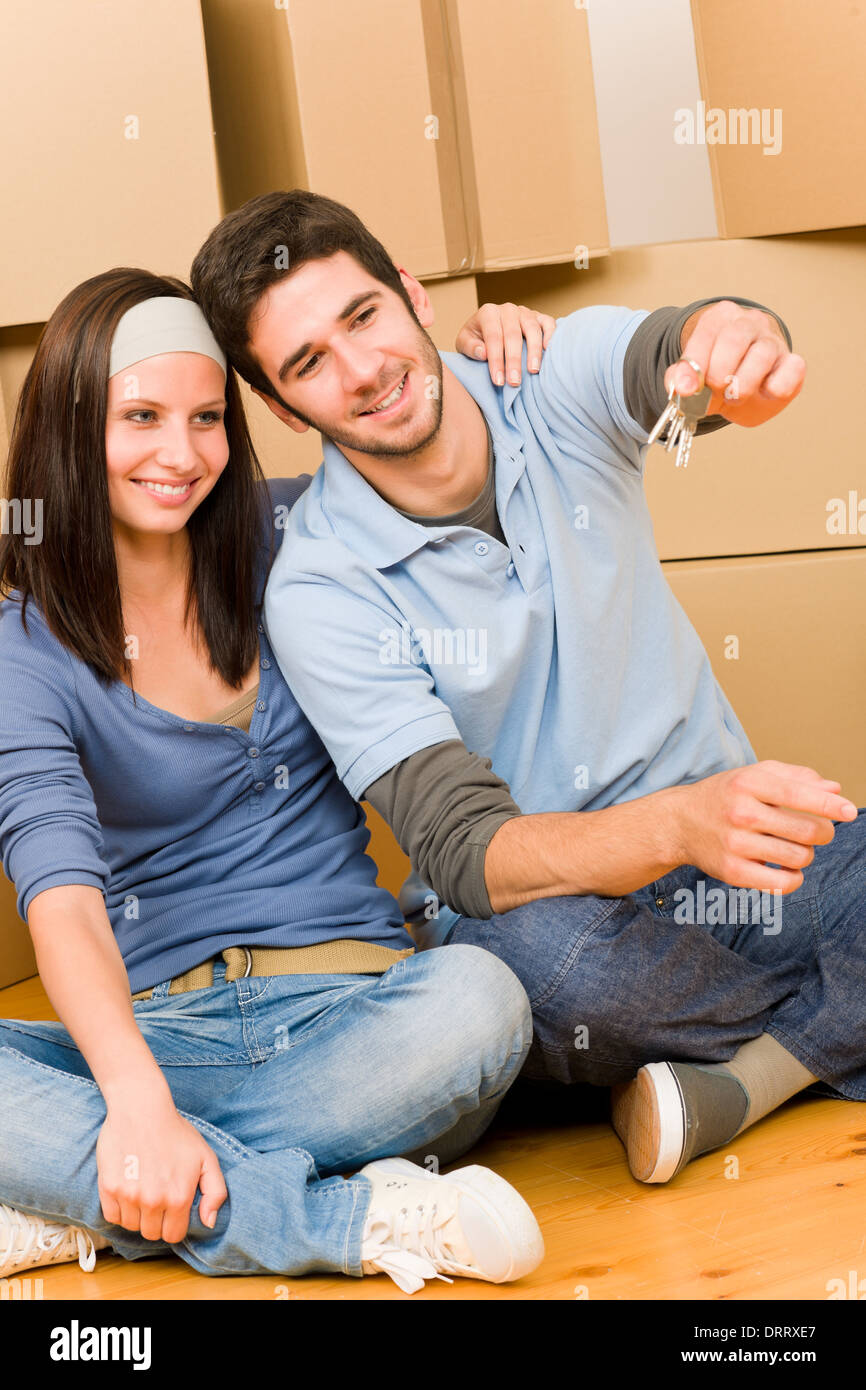 Moving new home young couple hold keys Stock Photo - Alamy