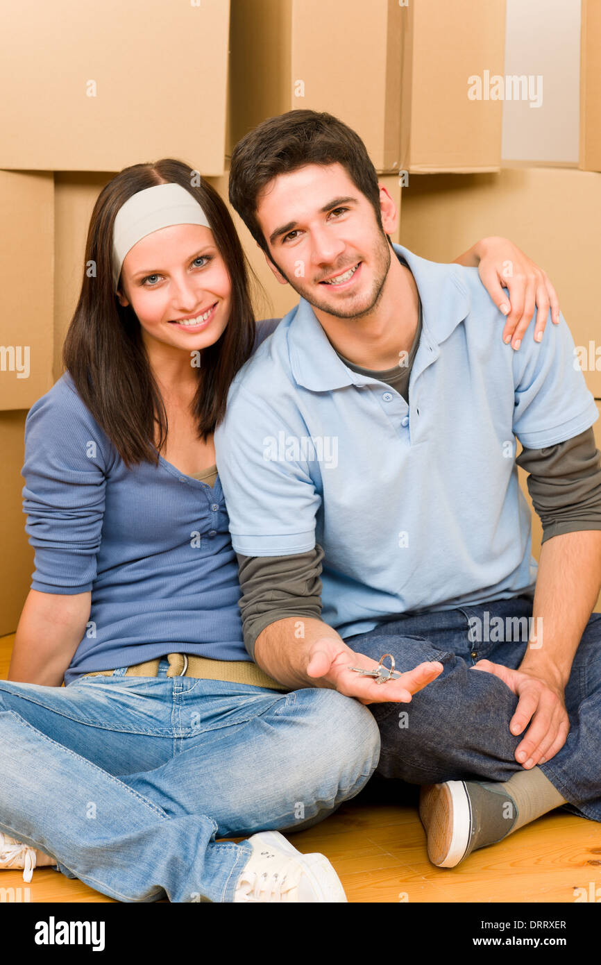 Moving new home young couple hold keys Stock Photo - Alamy