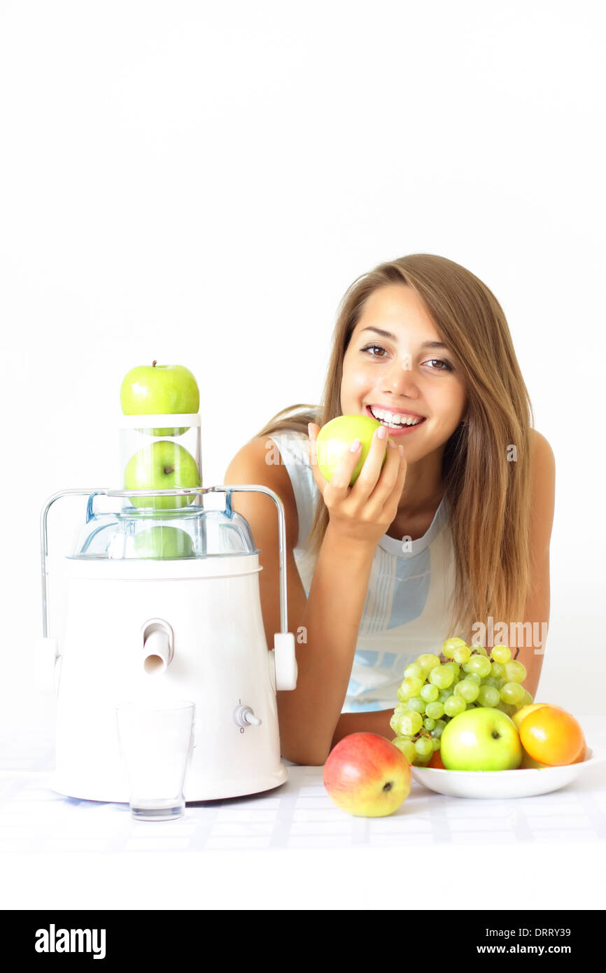 Happy girl about juicer Stock Photo Alamy