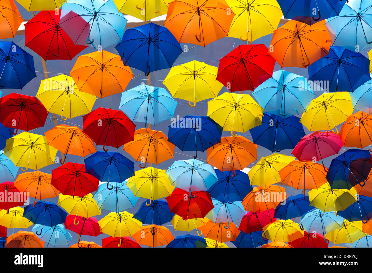 Lots of umbrellas coloring the sky in the city of Agueda, Portugal