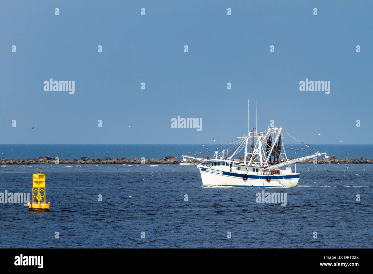 Shrimp boat returning from a day of shrimping in Fernandina Beach, Florida. Stock Photo