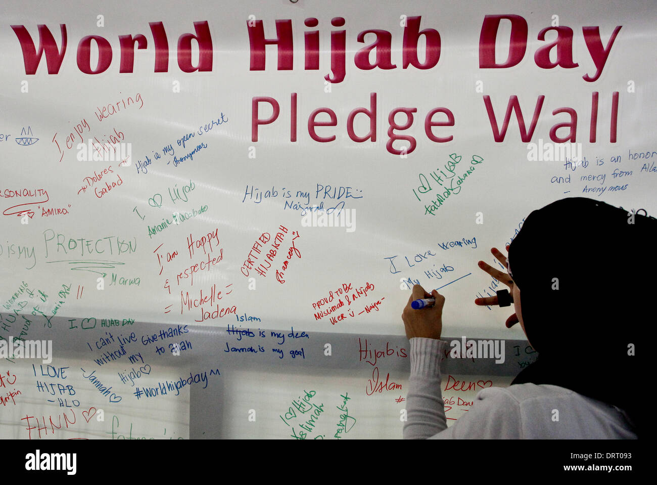 Quezon, Philippines. 1st Feb, 2014. Muslim and non-Muslim women signed pledges for the World Hijab Day in Quezon City on February 1, 2014. In World Hijab day, women from both Muslim and non-Muslim women are invited to wear Hijab (veil) for a day to foster religious tolerance and understanding why Muslim women wear Hijab. Credit:  Mark Fredesjed Cristino/Alamy Live News Stock Photo