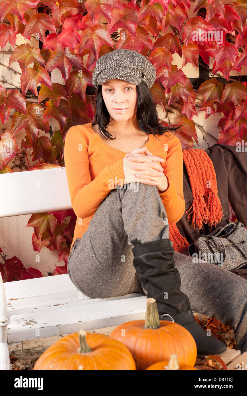 Autumn park bench young woman with pumpkins Stock Photo - Alamy