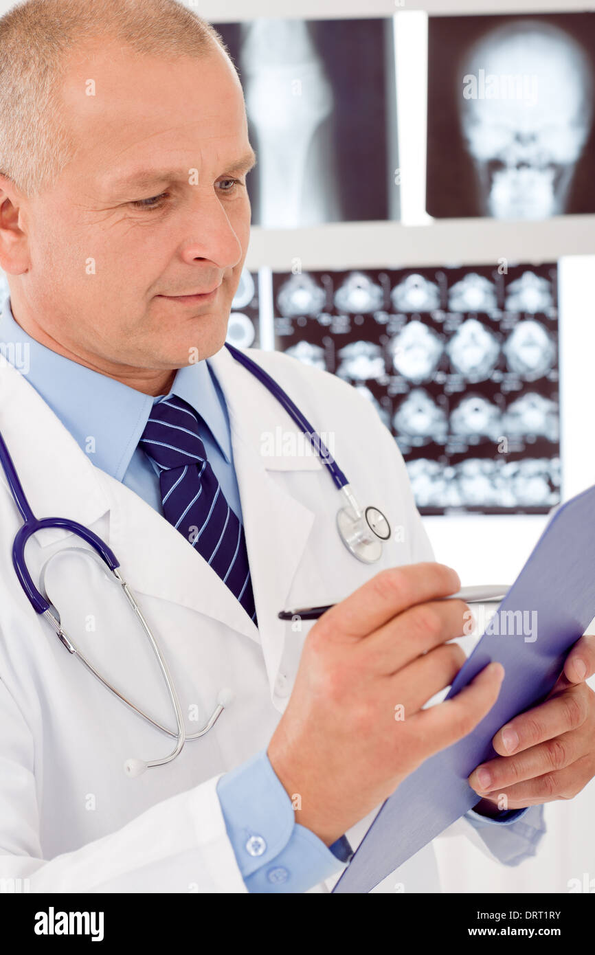 Serious mature male doctor hi-res stock photography and images - Alamy