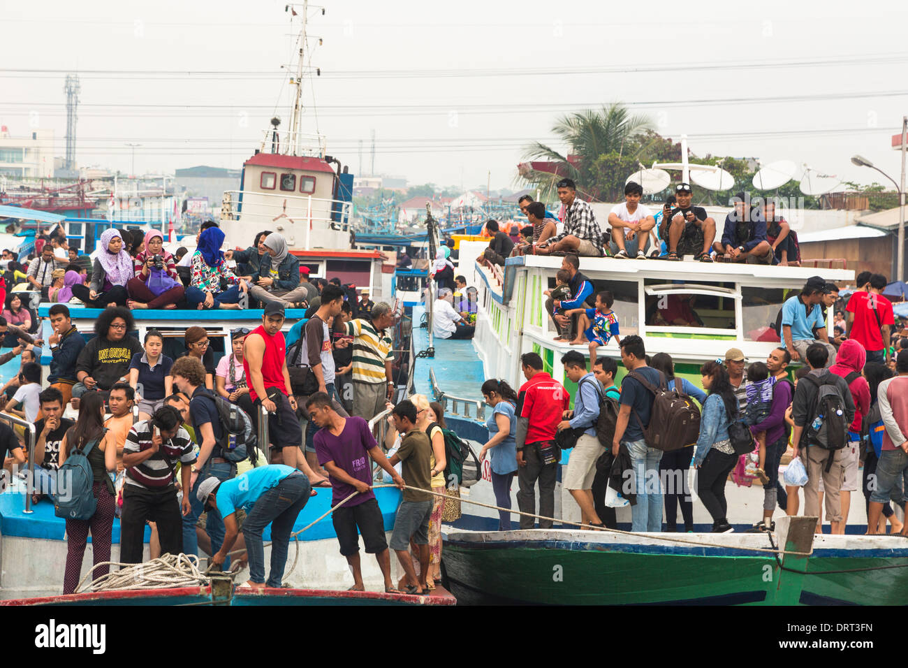 Overcrowded ferry leaving the Muara Angke harbor in Jakarta for the 1000 islands (Pulau seribu), Indonesia Stock Photo