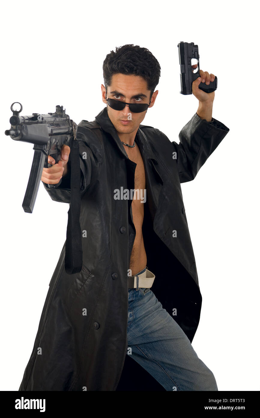 Handsome man with gun in leather raincoat Stock Photo