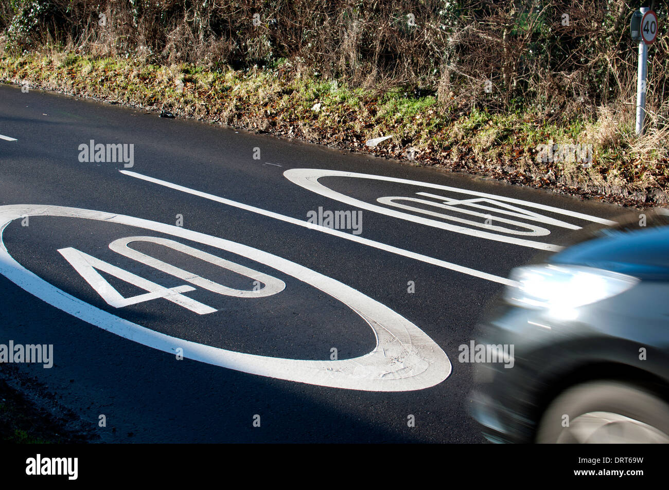 40 mph speed limit markings on road, UK Stock Photo