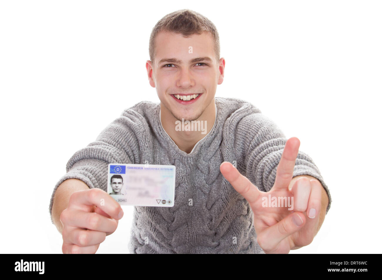 16 to 18 year old boy just received his driver license Stock Photo - Alamy
