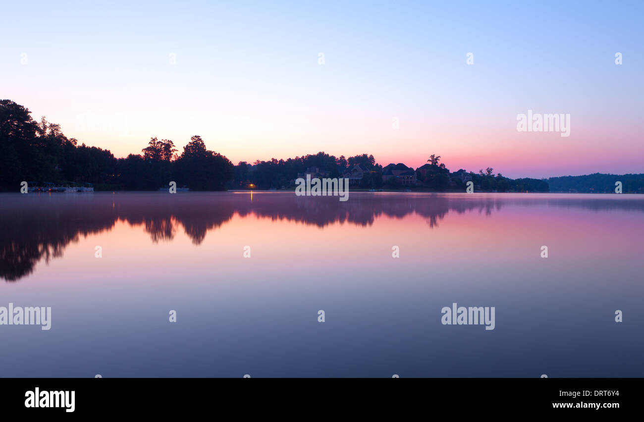 Misty morning at the lake Stock Photo - Alamy