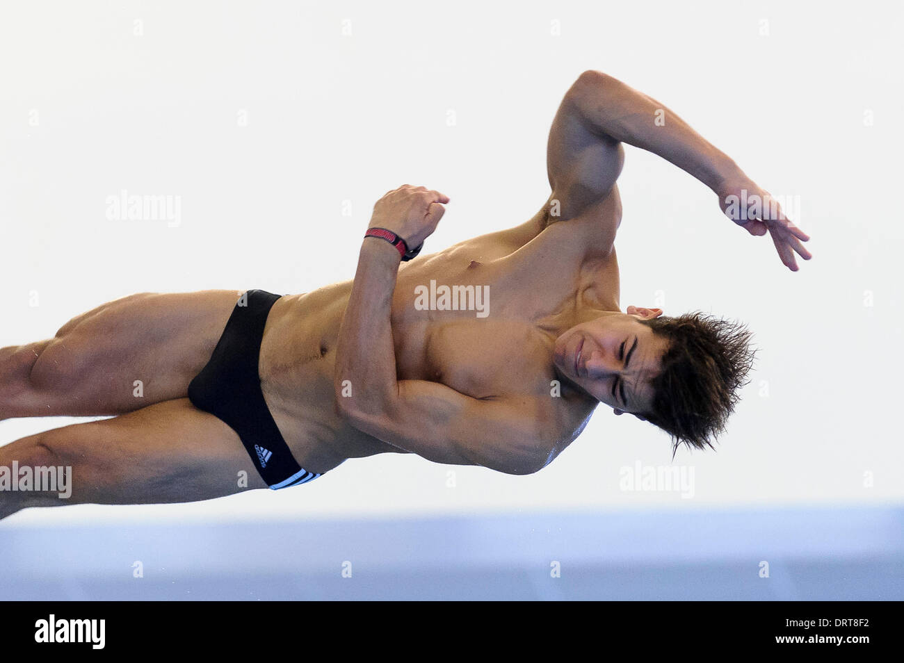 Southend-on-Sea, England. 1st Feb, 2014. Duran Omer of Southend Diving competes during the Mens 3m Springboard Preliminary on Day 2 of the British Gas Diving National Cup 2014 from Southend Swimming and Diving Centre. Credit:  Action Plus Sports Images/Alamy Live News Stock Photo