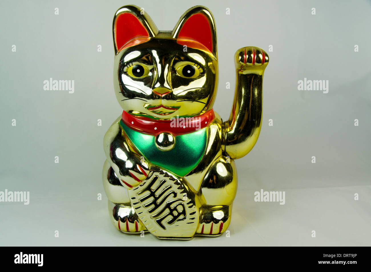 Maneki Neko Japanese Waving or Beckoning Cat, good luck charm. Stock Photo