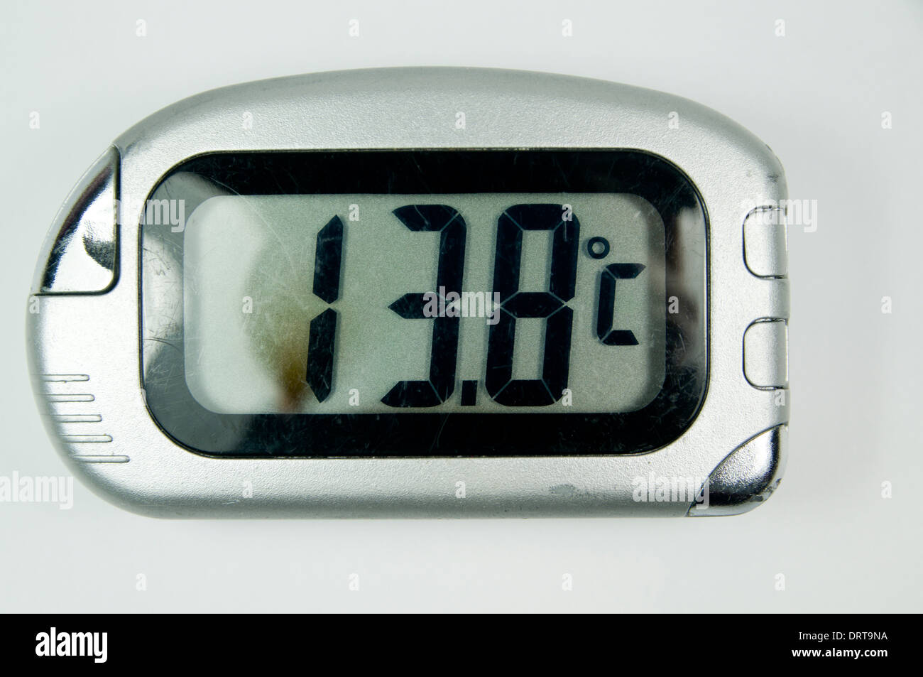Digital thermometer showing 13.8 degrees C. Stock Photo