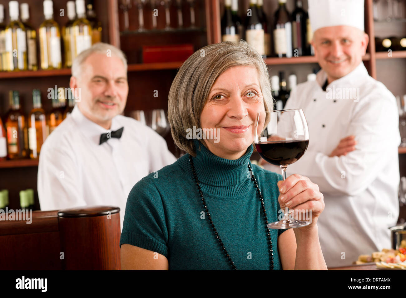 Restaurant manager taste glass red wine bar Stock Photo