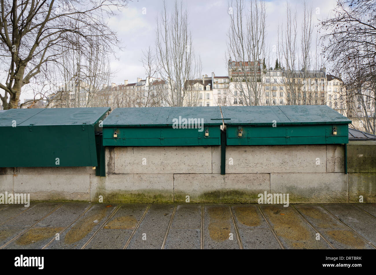 The Bouquinistes, banks of the Seine, bookseller boxes along the Seine closed due to bad weather. Paris, France. Stock Photo