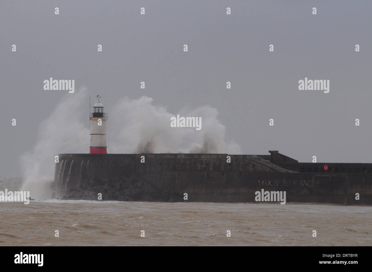 Newhaven, Sussex, UK. 1st Feb, 2014.Waves crash over the lighthouse during another stormy period on the Sussex coast.. Credit:  David Burr/Alamy Live News Stock Photo