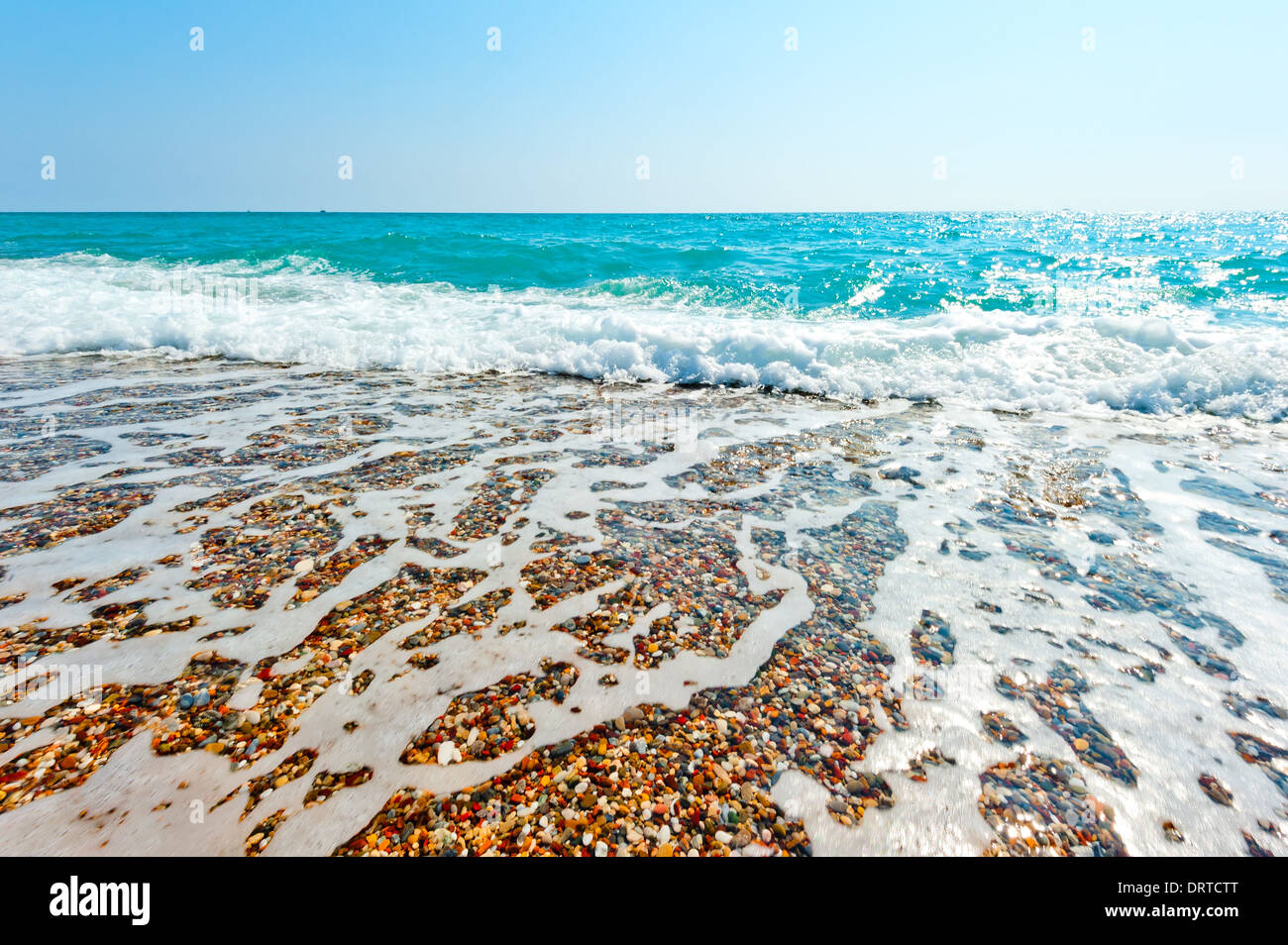 clear sea water and pebble beach Stock Photo - Alamy