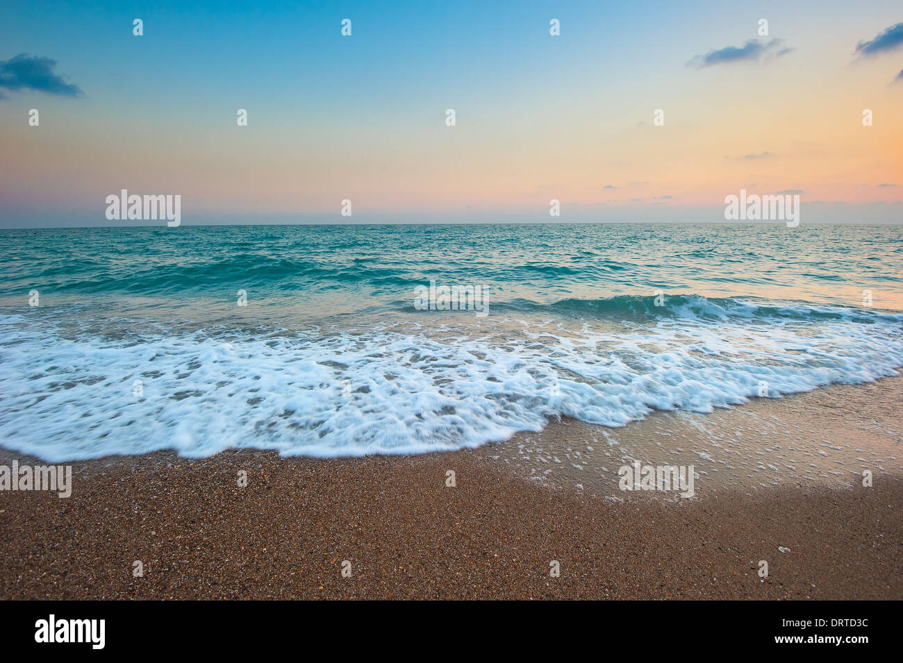 Waves sandy beach hi-res stock photography and images - Alamy