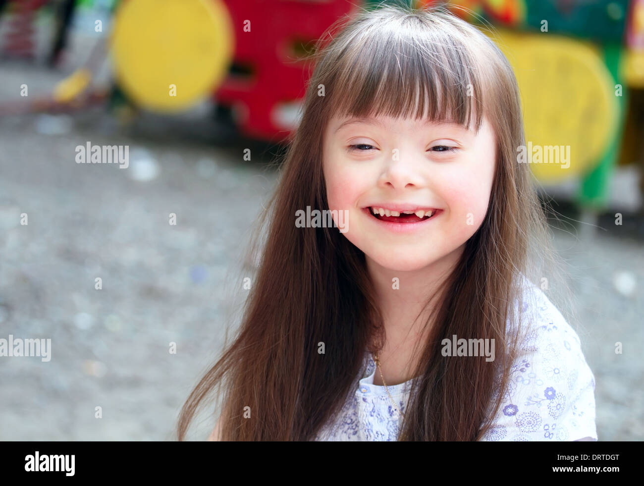 Portrait of beautiful young girl on the playground. Stock Photo