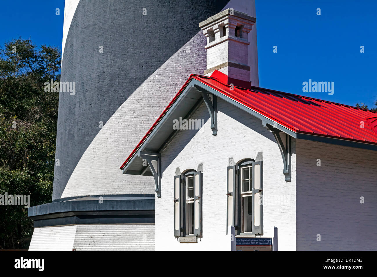 Red roof of Saint Augustine cottage and lighthouse built in 1874 and