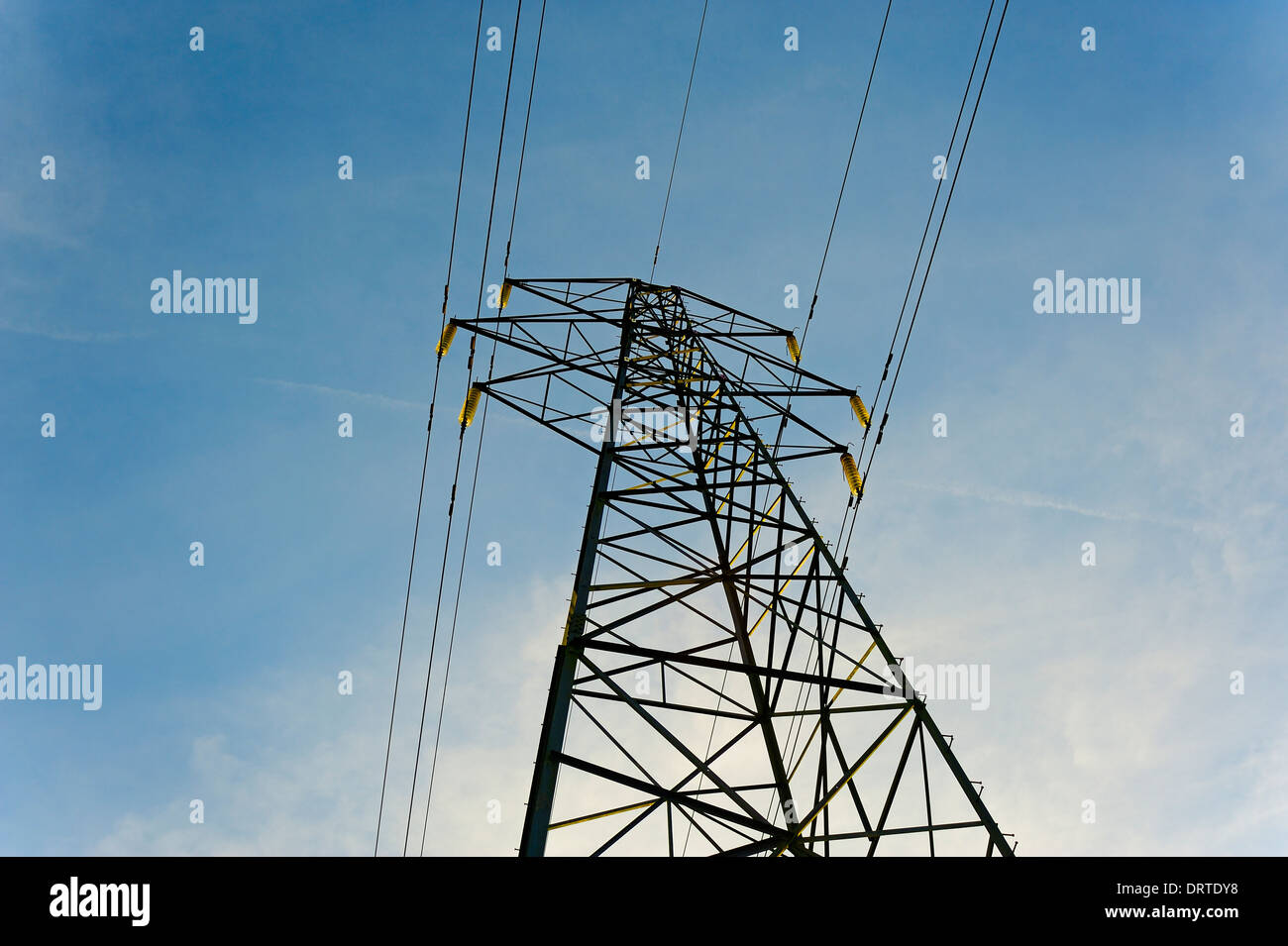 ELECTRICITY PYLON AGAINST A BLUE SKY Stock Photo