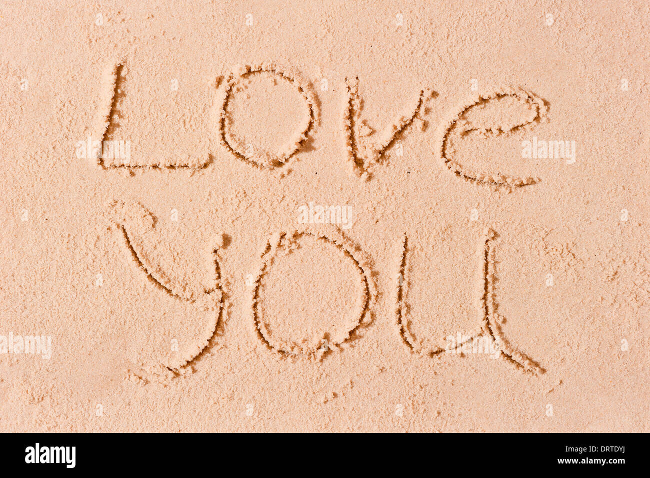 I love you written on wet sand on the beach Stock Photo - Alamy