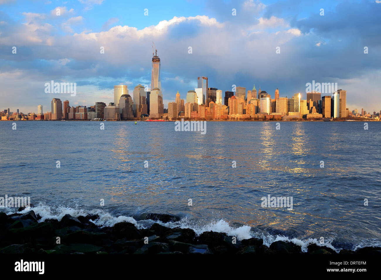 Downtown Manhattan skyline at sunset over Hudson River in New York City ...