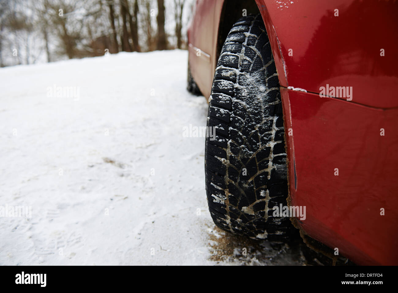Winter tires of a car in the snow. Driving in the winter Stock Photo